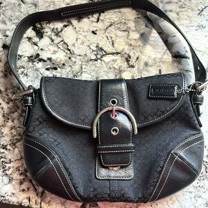 Small black coach shoulder bag.